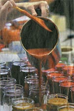 Cranberry spice is poured by Kris Vrtiska at the production table.